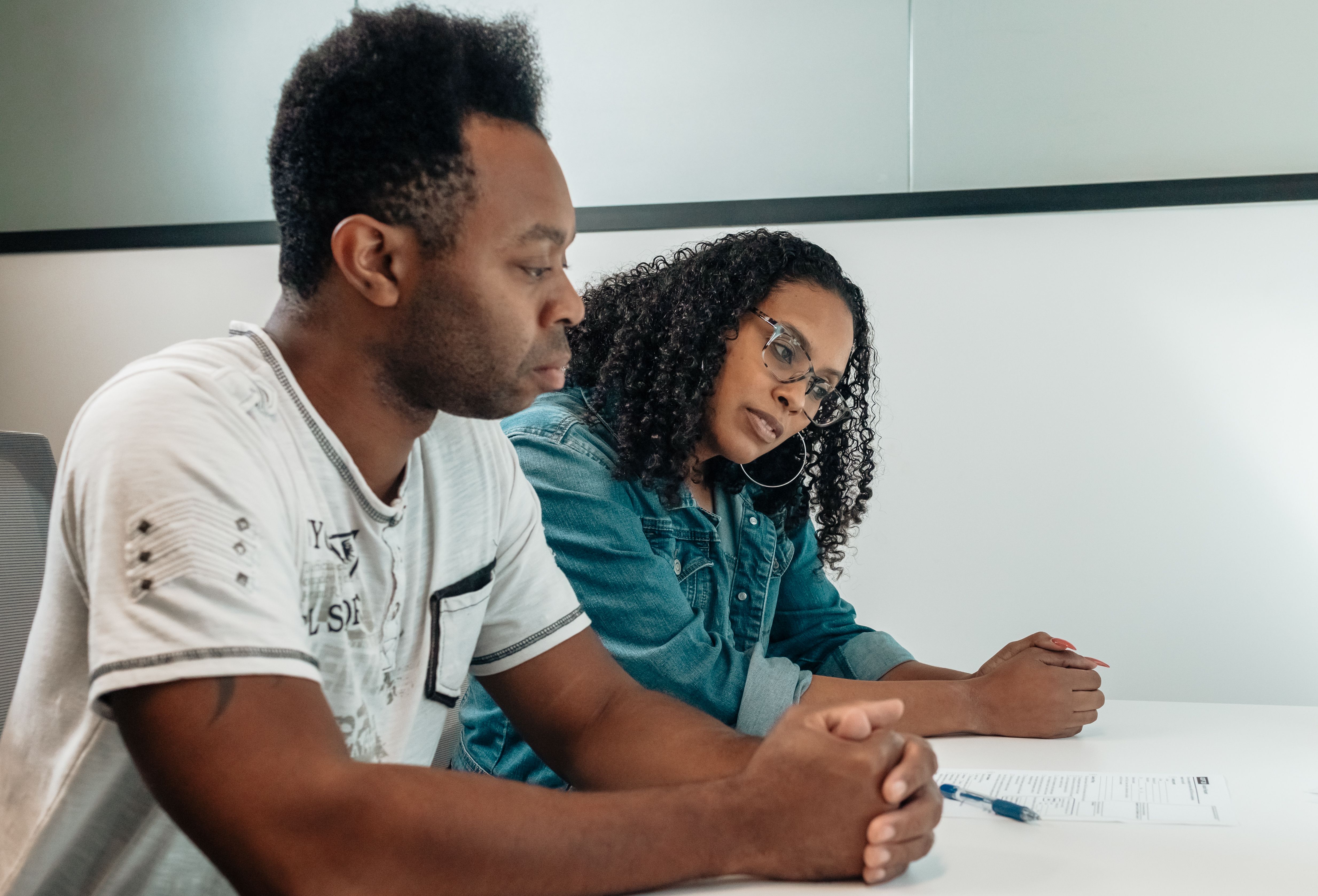 Two researchers reviewing a document together