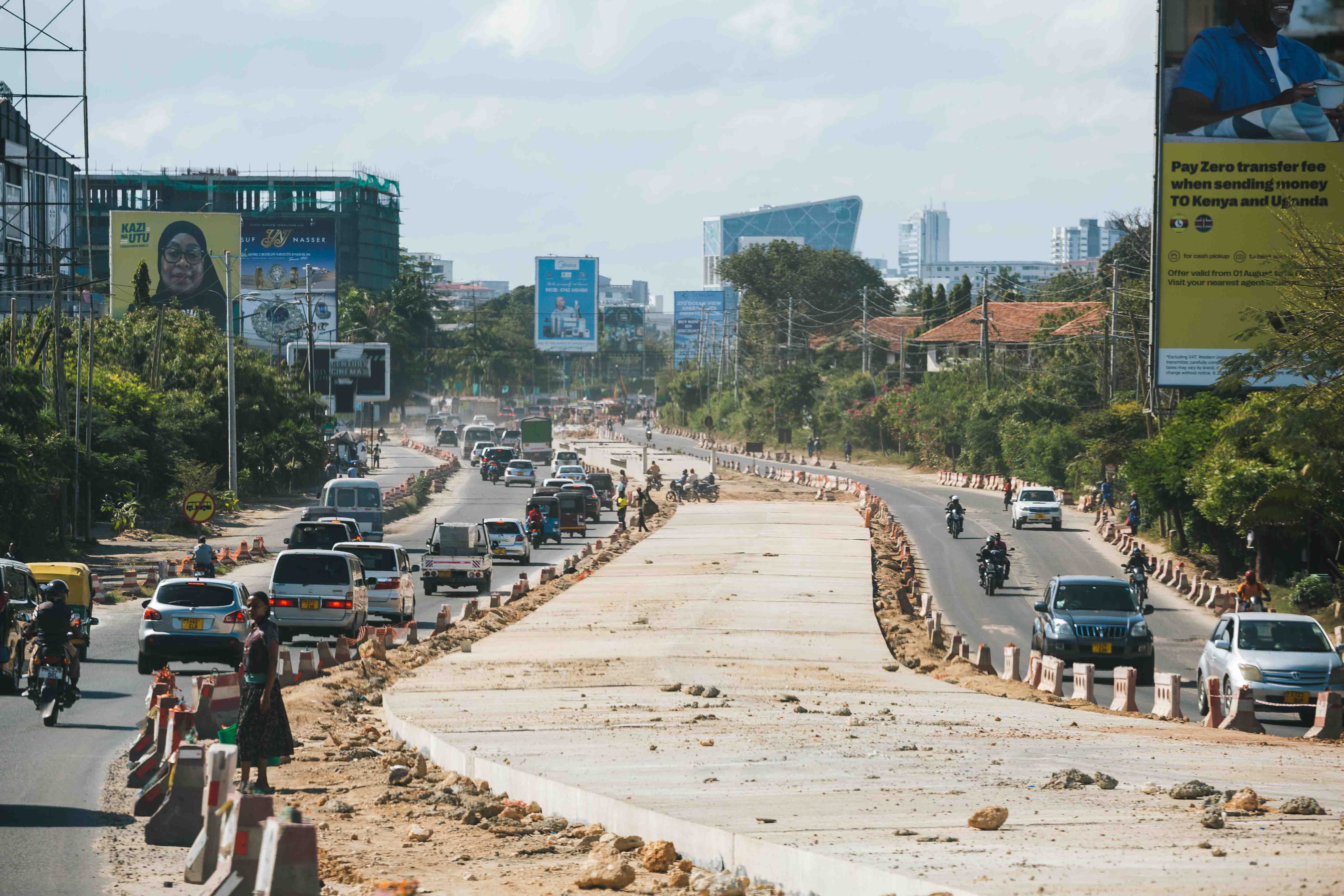 A busy urban road under construction in an East African city